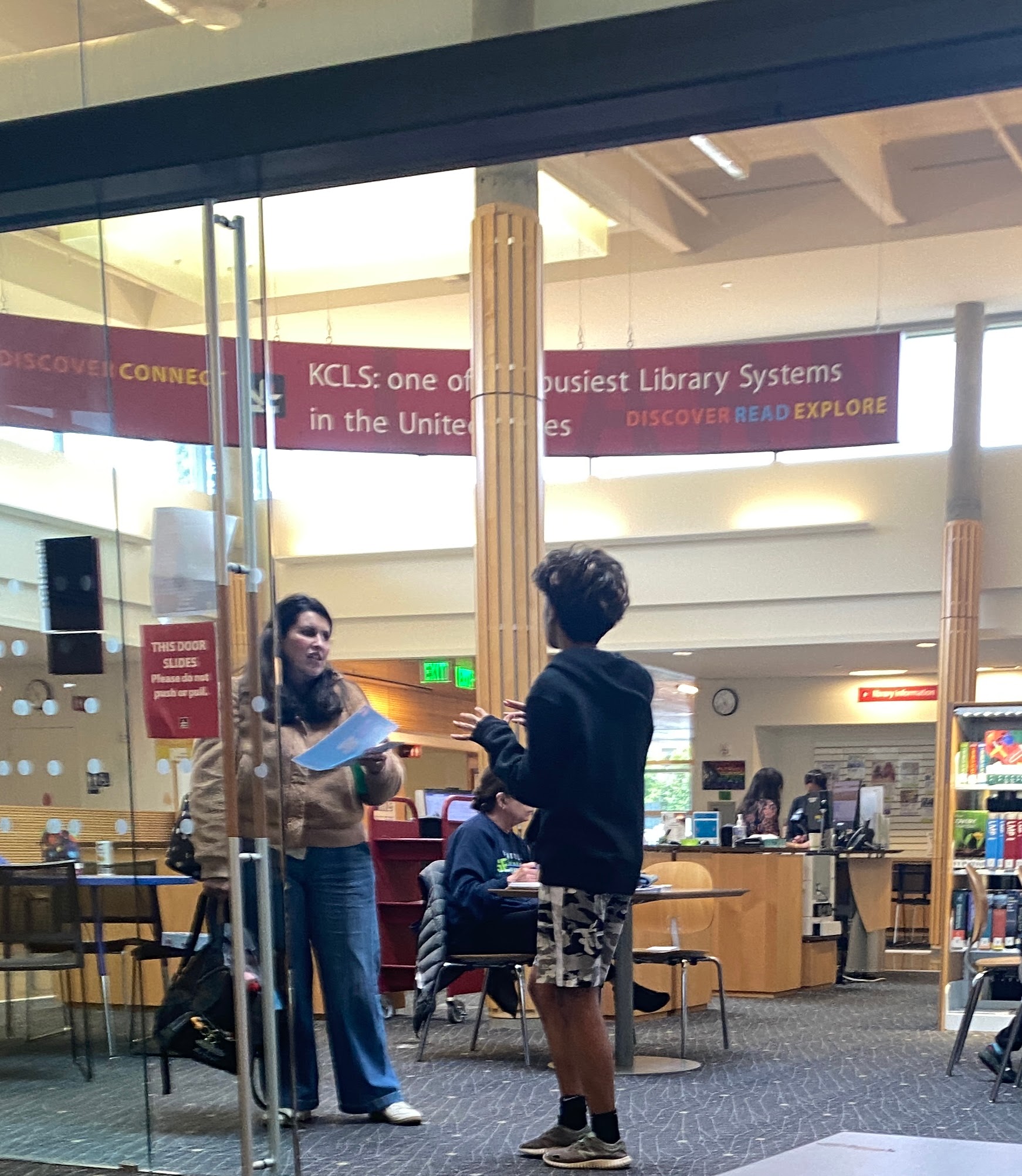 Attendees engaging at a Breathe-On library awareness session