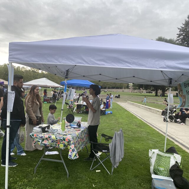 Breathe-On outreach tent at a community event in the park